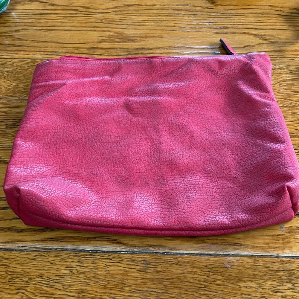 Free People red faux pebble leather travel zip bag.  Red. Approximately 11”X14”.